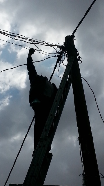 Waleed working on power lines